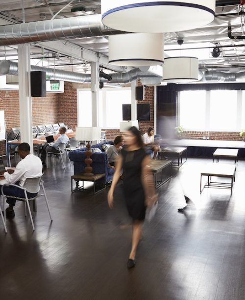 Interior Of Busy Design Office With Staff